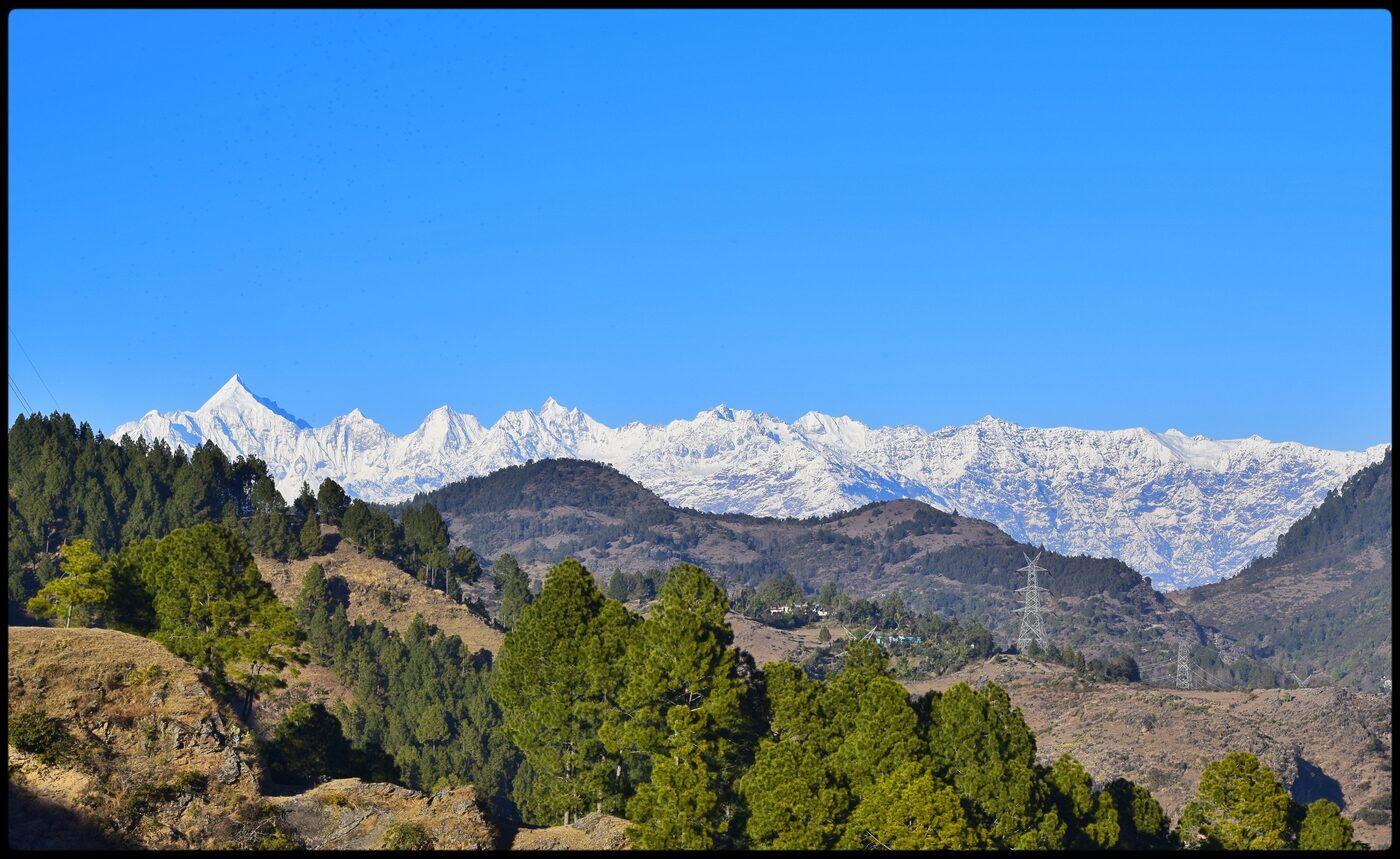 The five snow-capped Panchachuli peaks glowing at sunrise above the Haat Valley.